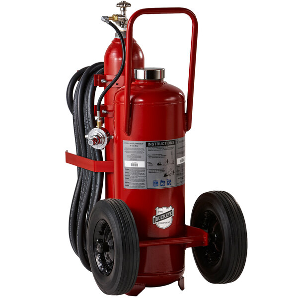 A Buckeye red fire extinguisher on rubber wheels with a black hose.