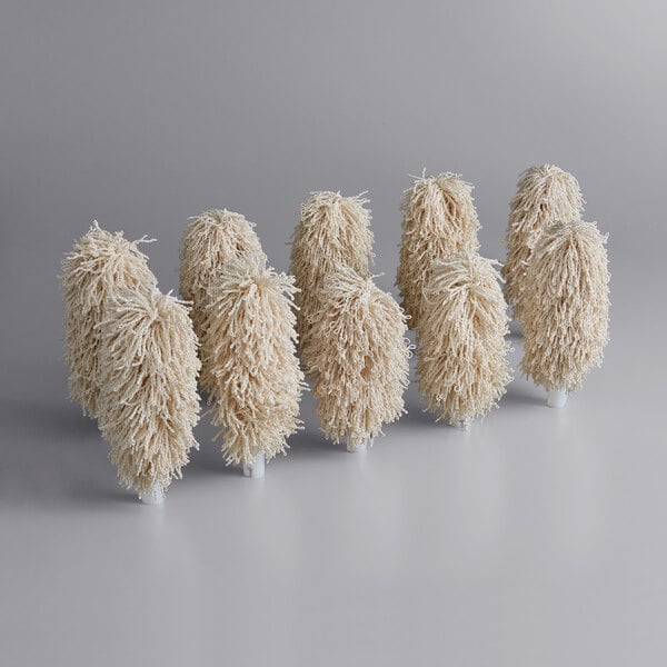 A group of white fluffy Noble Products brushes.