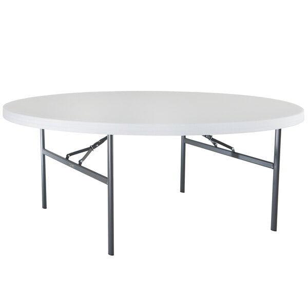 A white Lifetime round folding table with metal legs.