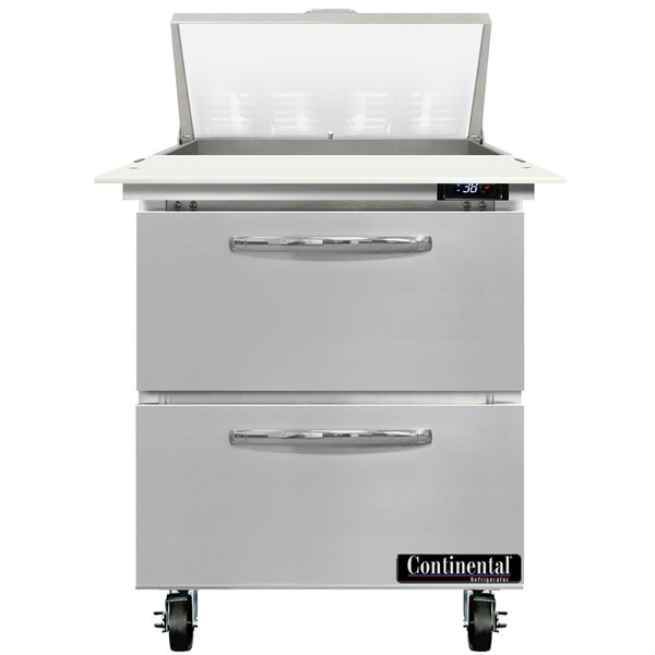 A stainless steel Continental Refrigerator with two open drawers.