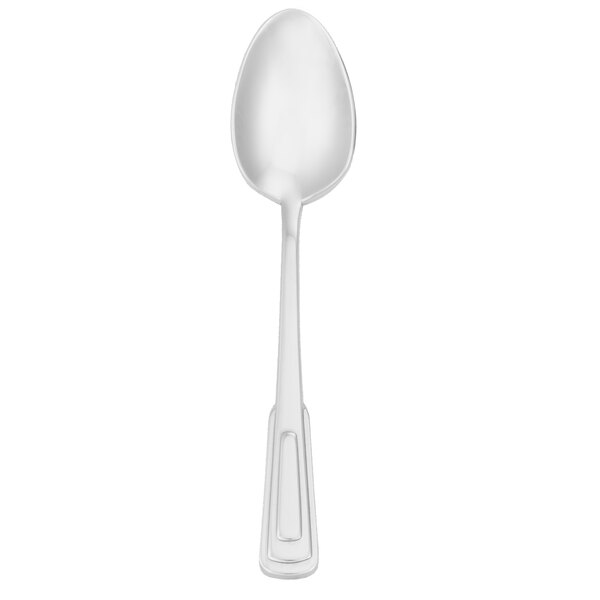 A Walco stainless steel demitasse spoon with a silver handle.
