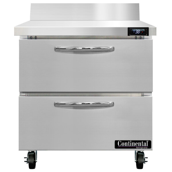 A white Continental worktop refrigerator with two drawers.