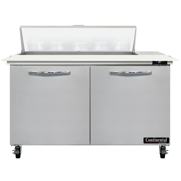 A stainless steel Continental Refrigerator with two doors and a cutting top.