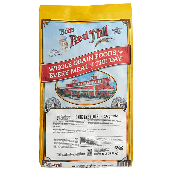 A bag of Bob's Red Mill Organic Dark Rye Flour on a white background.