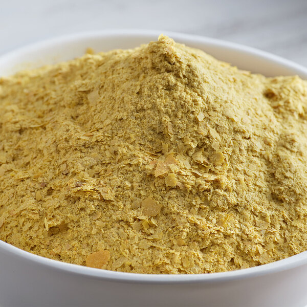 A bowl of Bob's Red Mill large flake nutritional yeast.