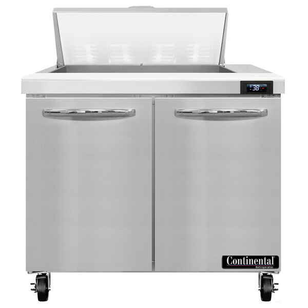 A Continental Refrigerator stainless steel 2 door refrigerated sandwich prep table on a counter.