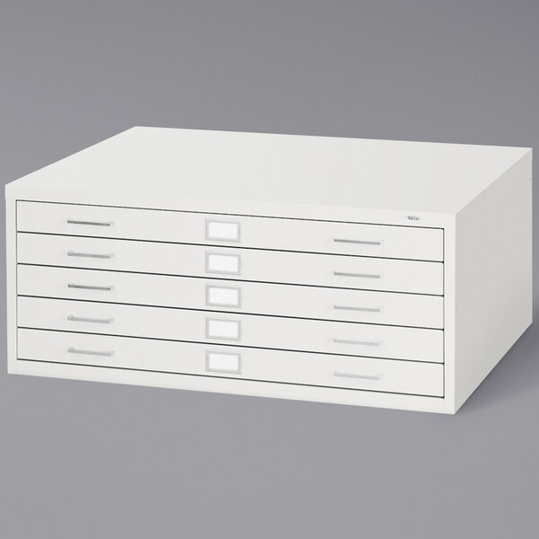 A Safco white steel file cabinet with five drawers.