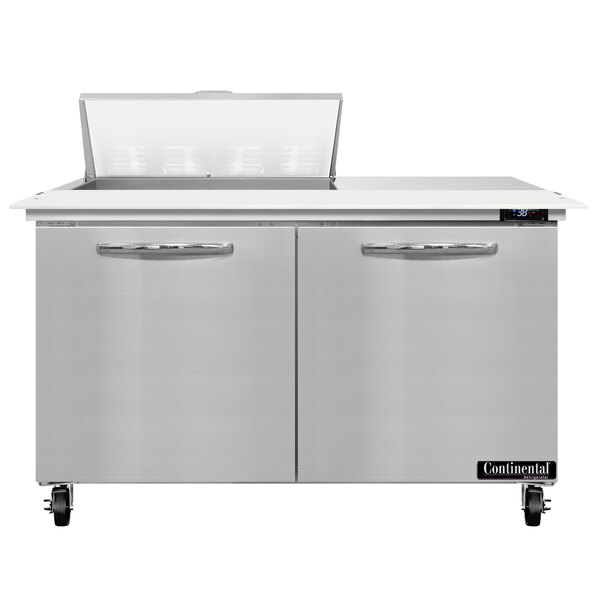 A stainless steel Continental Refrigerator with 2 doors and a cutting top.