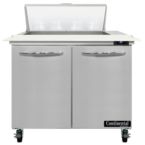 A Continental Refrigerator stainless steel 2 door cutting top sandwich prep table.