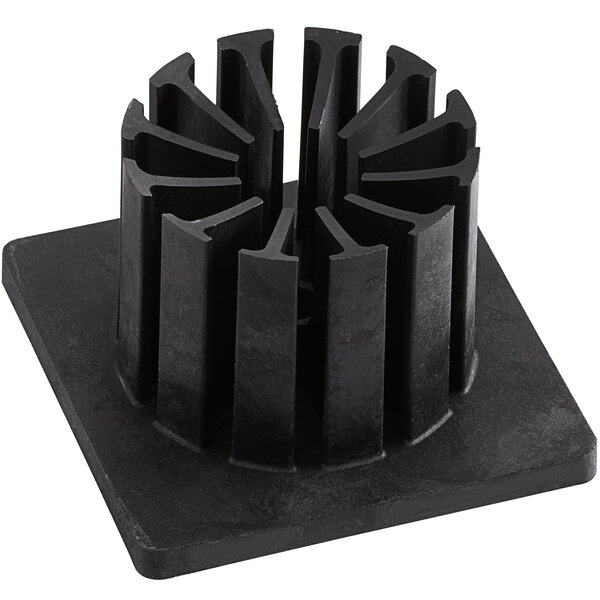 A black metal push block with a circular design and four holes.