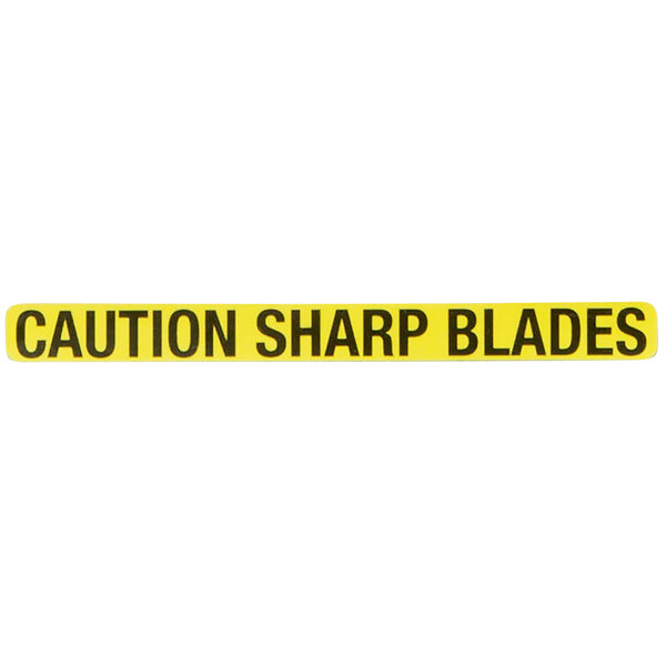A yellow rectangular caution sign with black text that reads "Caution: Sharp Blades"