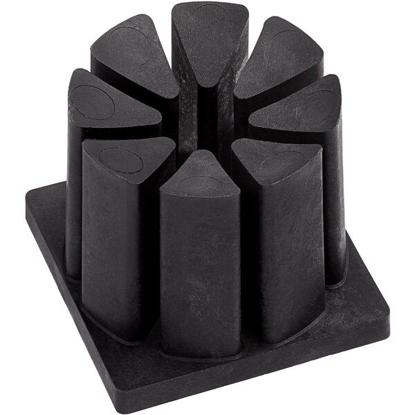 A black plastic block with five circular holes.