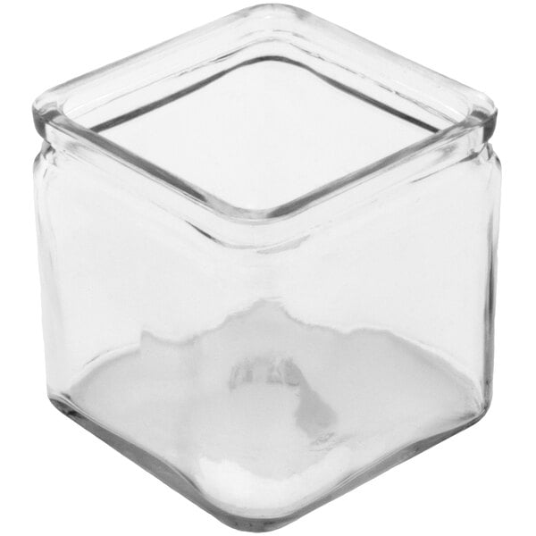 A clear square glass container with a lid.