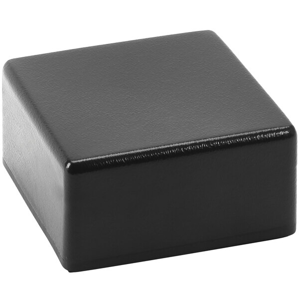 A black square Delfin CR-663 pedestal on a white surface.