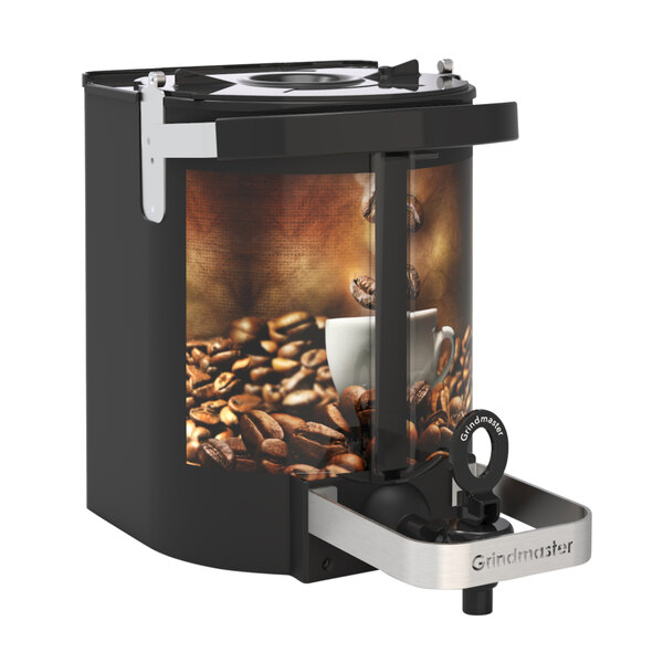 A Grindmaster coffee shuttle on a counter with a white cup and brown coffee.