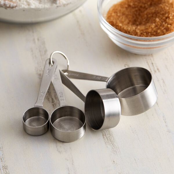 A close-up of a Vollrath stainless steel measuring spoon.