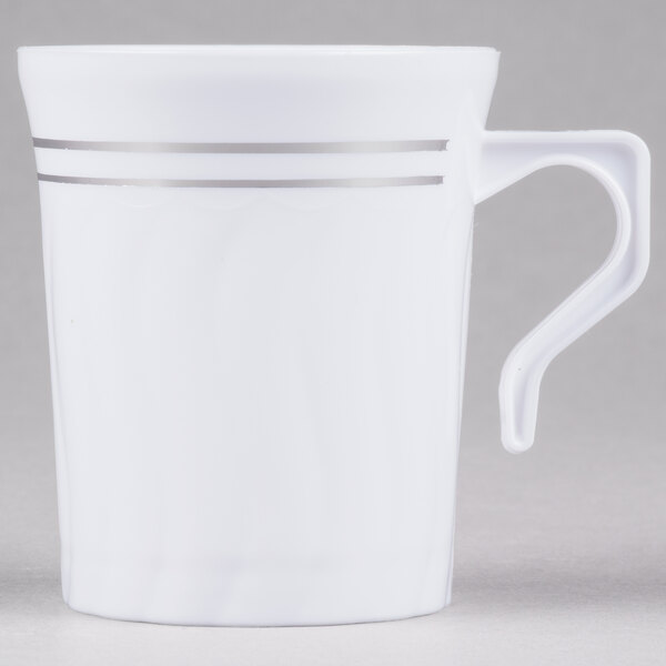 A white Fineline plastic coffee mug with silver stripes.