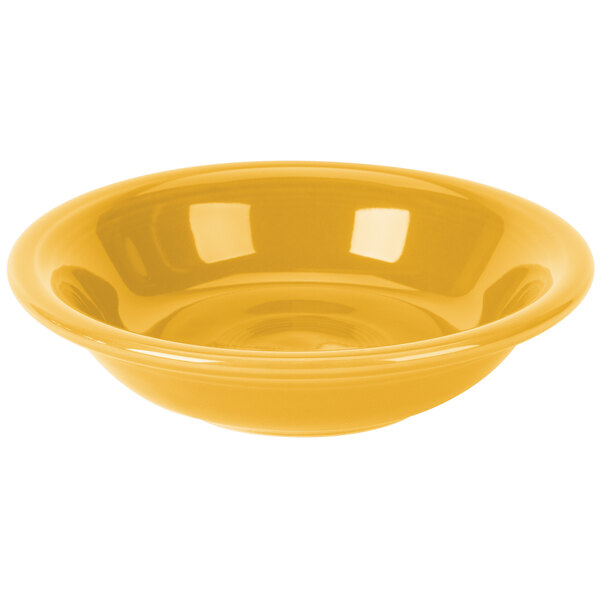 A yellow Fiesta china bowl with a white background.