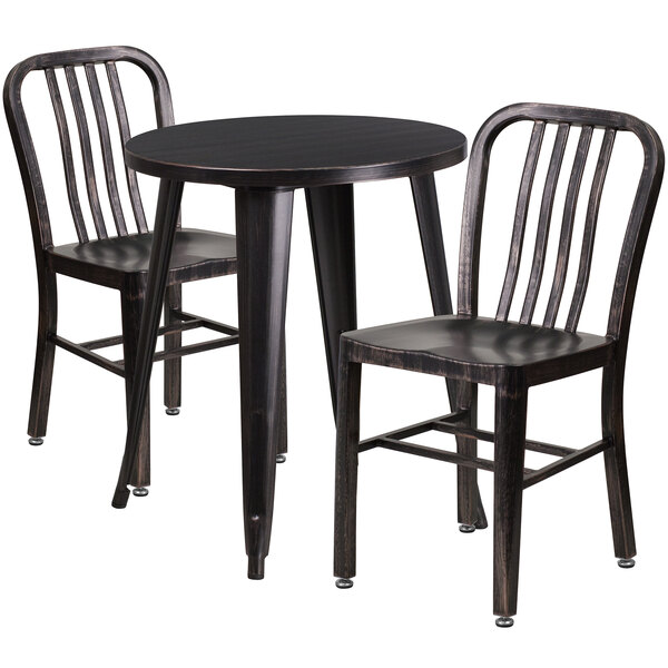 A Flash Furniture round metal table in black with antique gold accents and two vertical slat chairs.