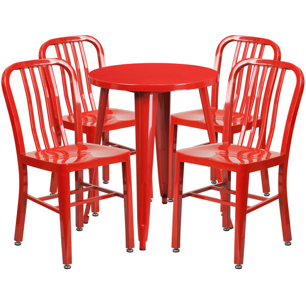 A red metal table with four red chairs.