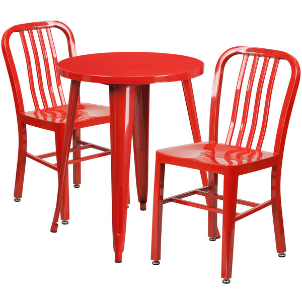 A red table with two red chairs.