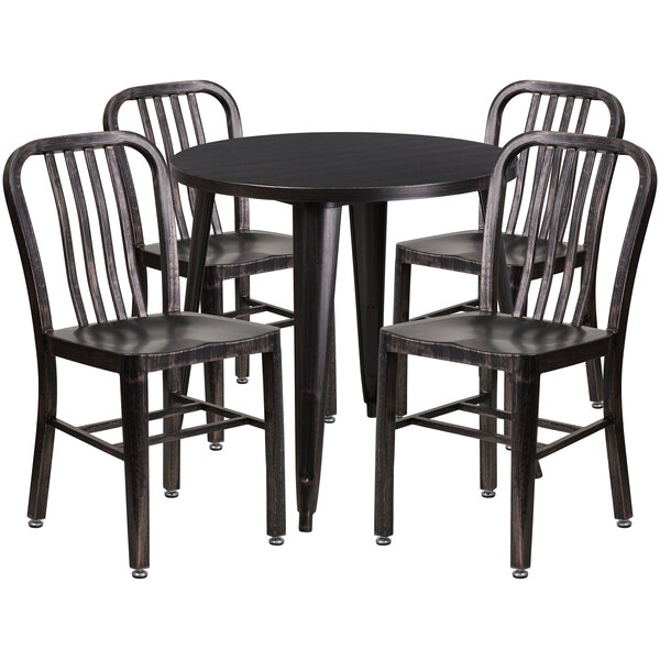A black metal Flash Furniture table with four black chairs around it.