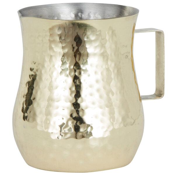 An American Metalcraft gold hammered stainless steel bell creamer with a handle.