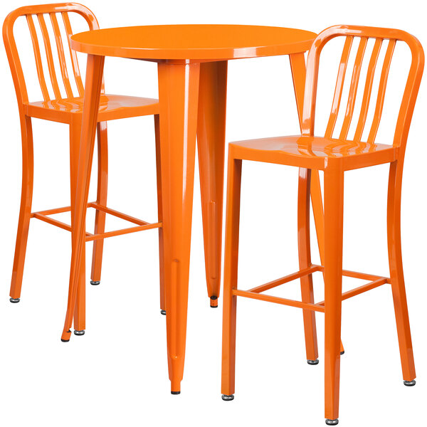 An orange Flash Furniture bar table with two orange chairs.