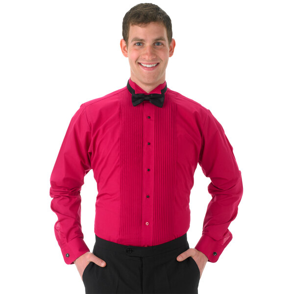 A man wearing a Henry Segal fuchsia tuxedo shirt with a black bow tie.