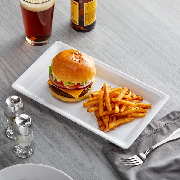 An American Metalcraft melamine platter with a cheeseburger and fries on it.