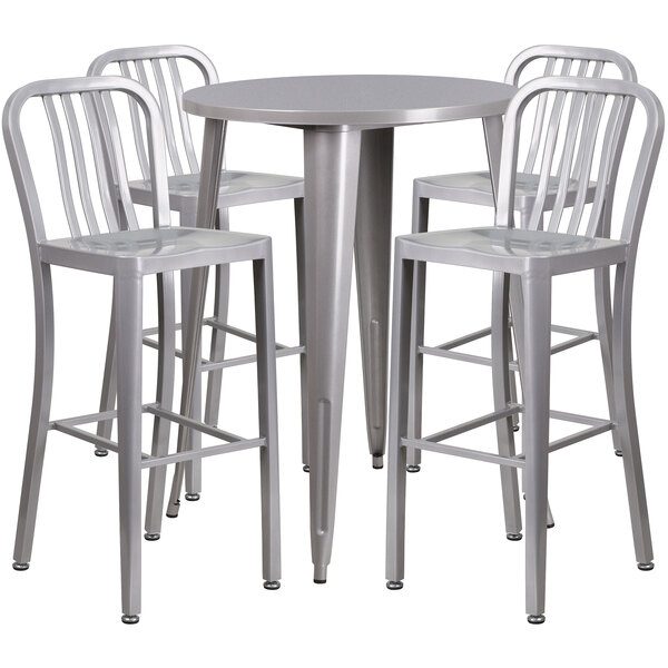 A Flash Furniture silver metal bar height table with four vertical slat back stools around it.