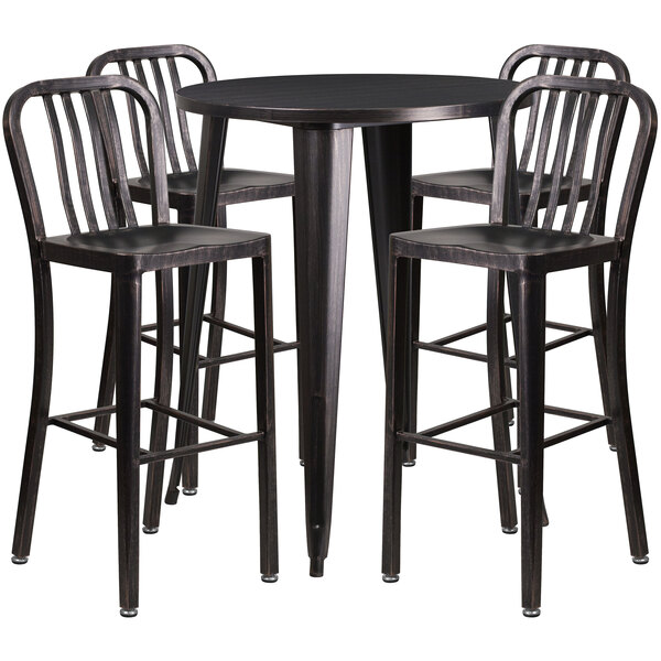 A Flash Furniture black metal bar height table with four black metal chairs with vertical slat backs.