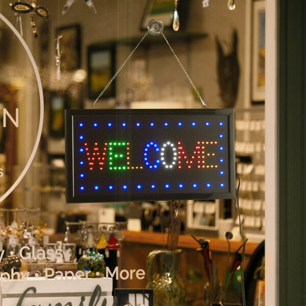 A rectangular LED welcome sign with lights on it.