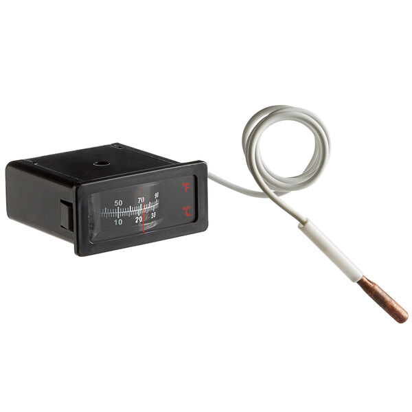 A black temperature indicator mechanism for a ServIt drawer warmer with a white wire.