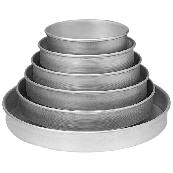 A stack of round metal cake pans.