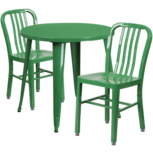 A green table with two green chairs.