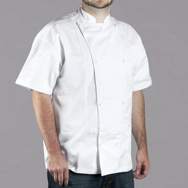 A man wearing a white Chef Revival short sleeve chef jacket.