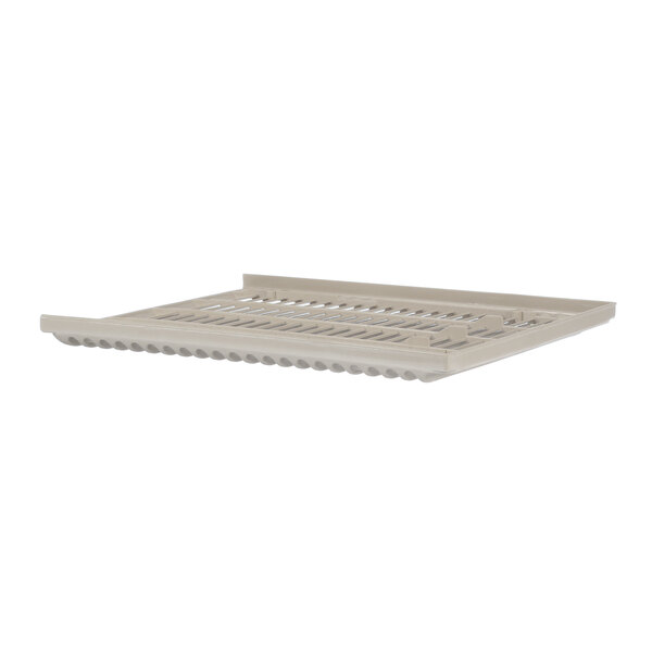A beige plastic tray with a metal grate over it.