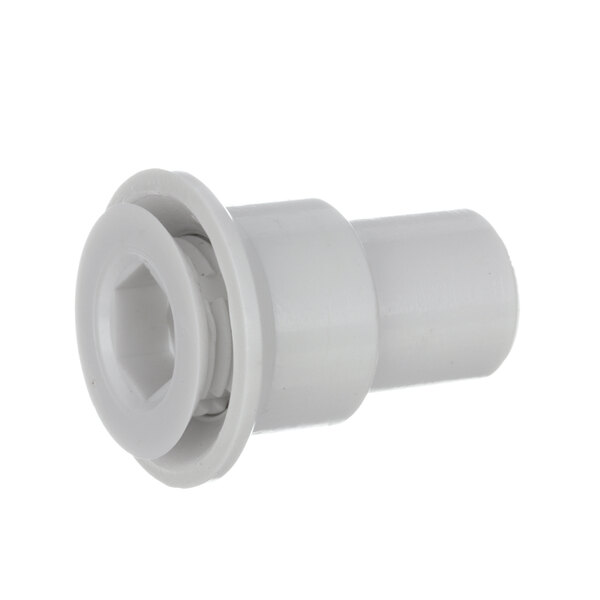A close-up of a white plastic pipe fitting with a screw.
