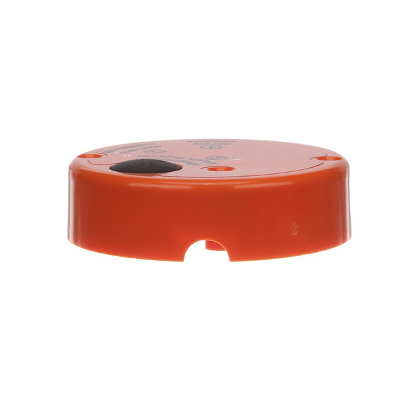 An orange plastic top housing for a Dynamic Mixers immersion blender.