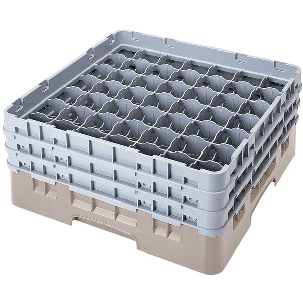 A beige plastic Cambro glass rack with compartments.