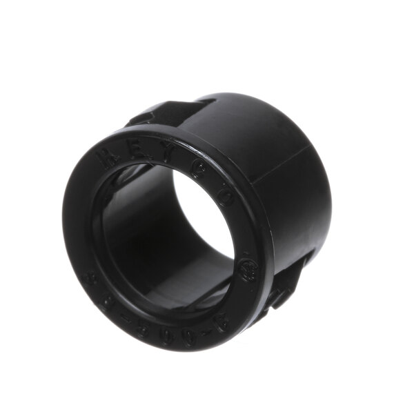 A black plastic Hobart bushing with a hole.