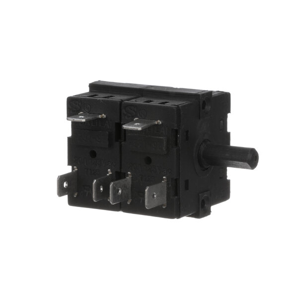 A black electrical switch with metal buttons and two wires.