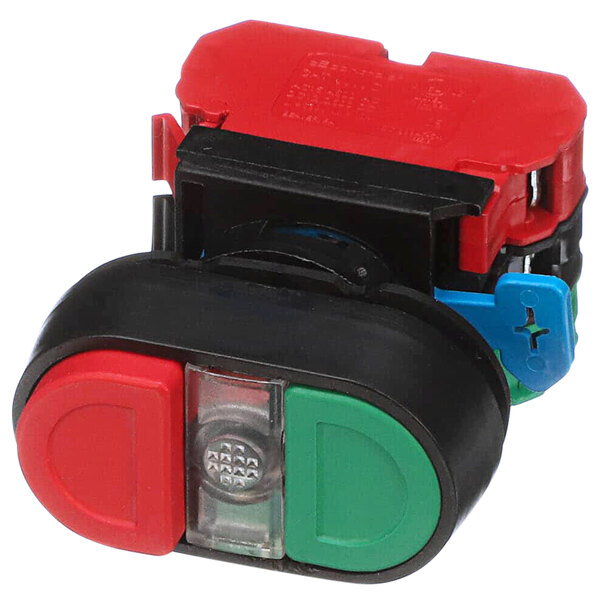A red and green Caddy dual voltage push button switch.