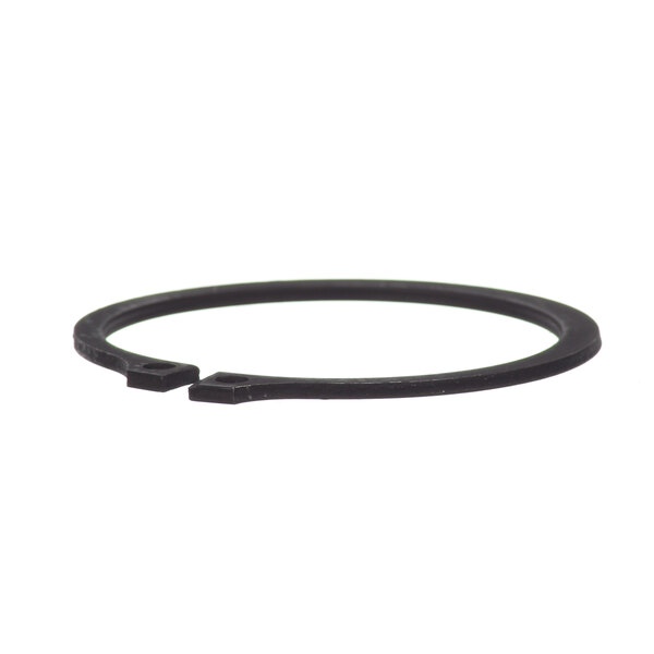 A close up of a black rubber retaining ring with a hole in it.