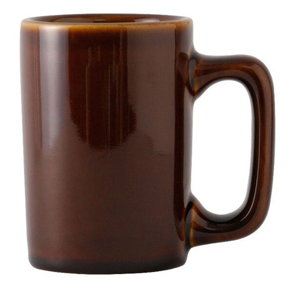 A brown Tuxton china mug with a handle.