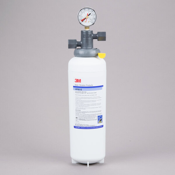 A 3M water filtration cartridge for ice machines with a gauge on top.