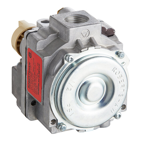 A Frymaster gas valve with a metal housing and red label.