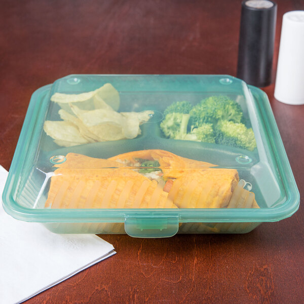 A jade green GET 3-compartment reusable container with food inside.