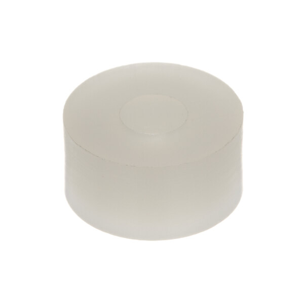 A white plastic cylinder with a circular hole in the middle.